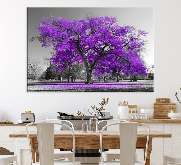 The Big Purple Tree Wall Art Canvas Print showcases a vibrant purple tree set against a black-and-white landscape.