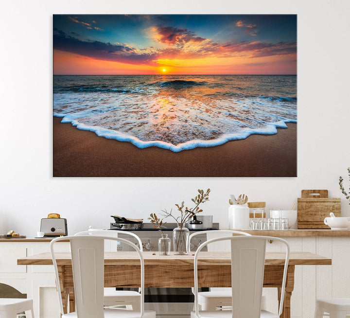 A Sunset with Calm Waves on the Beach Wall Art Canvas Print adorns the dining room.