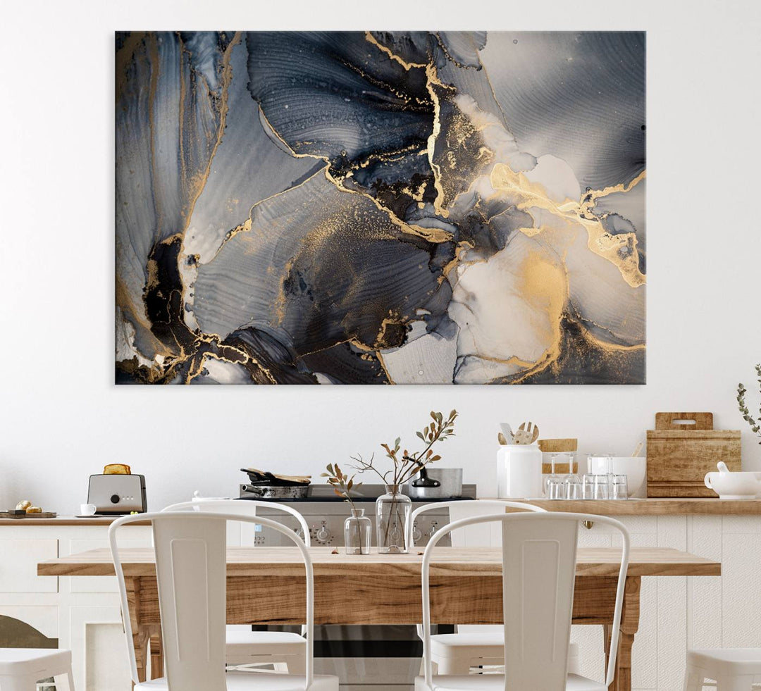 A Modern Marble Fluid Effect Abstract Wall Art with black, white, and gold swirls hangs in a modern kitchen.