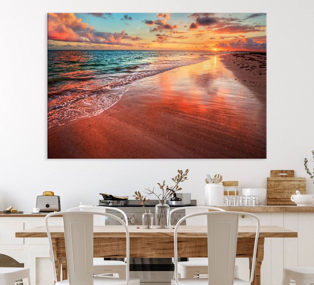 A Vibrant Sunset Beach Canvas Print with ocean waves and sandy shoreline enhances coastal-themed interiors.