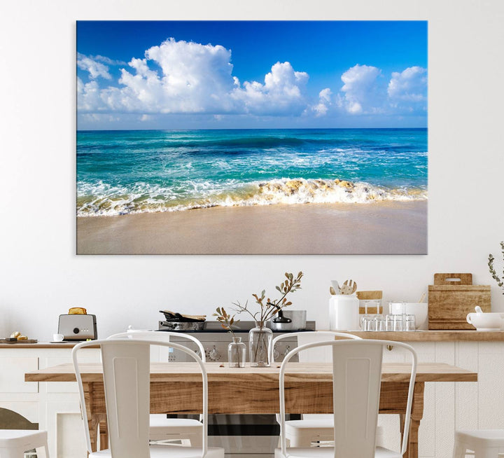 The Tropical Beach 3-Panel Canvas Wall Art features ocean waves gently lapping on a beach under blue skies, making it an ideal choice for coastal decor.