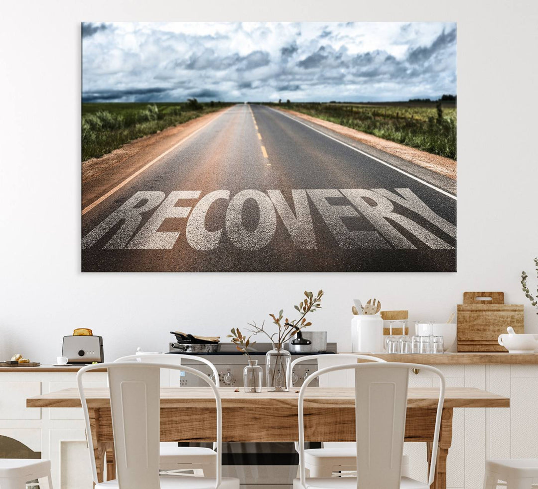 The Recovery Road Wall Art Canvas Print depicts a road under a cloudy horizon.