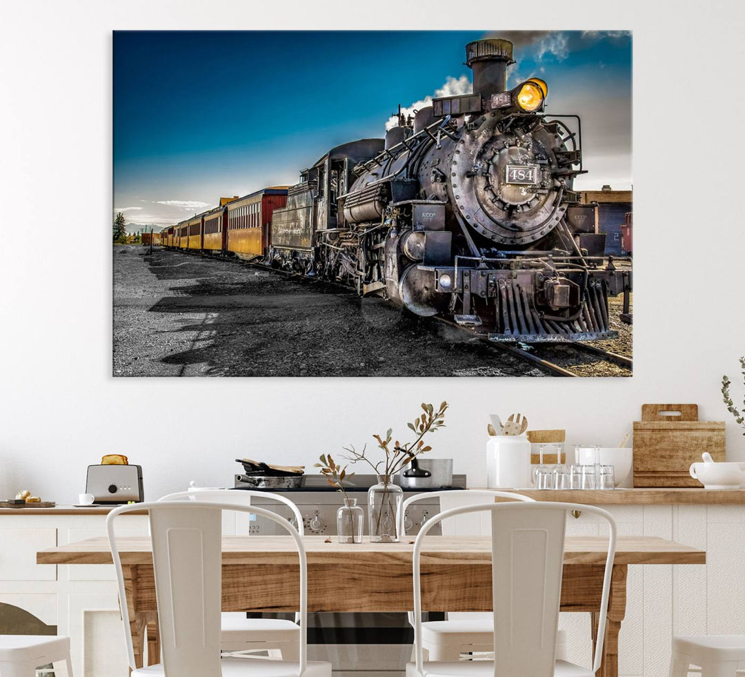 The Train Wall Art Canvas Print features a vintage steam train with a bright headlight.