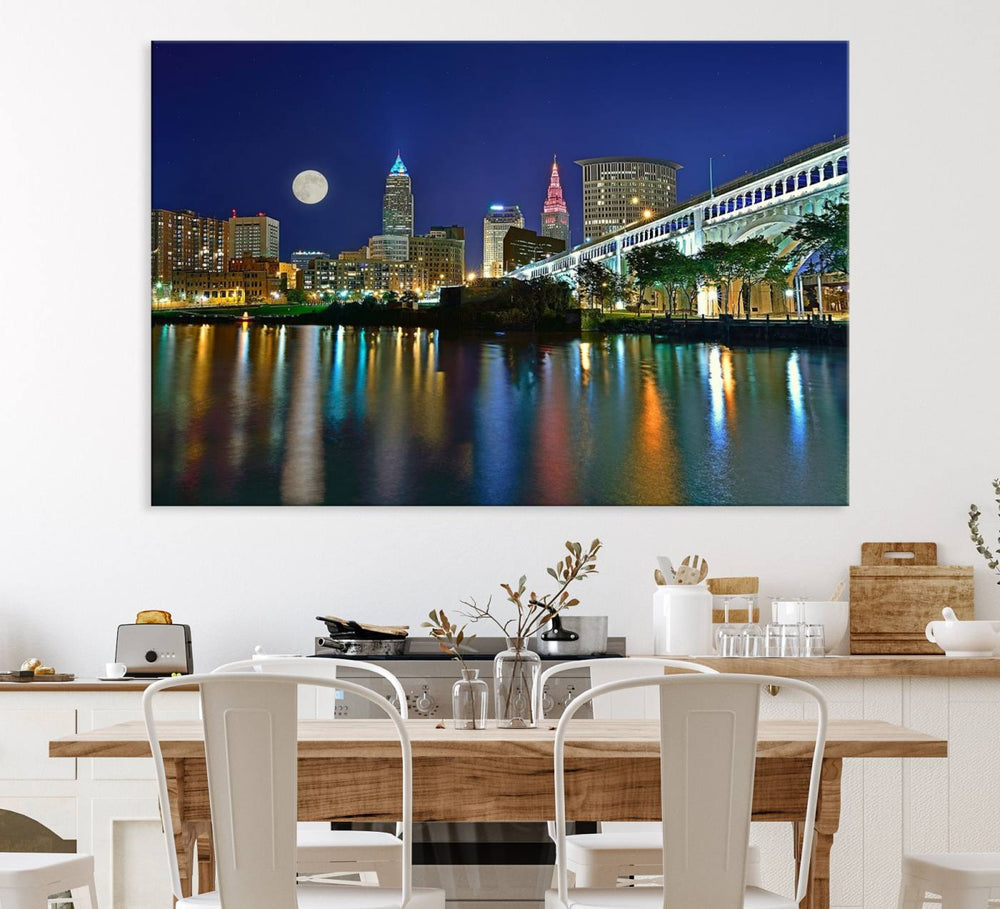 Cleveland City Lights Night Skyline Wall Art canvas showcases a moonlit cityscape reflected on water.