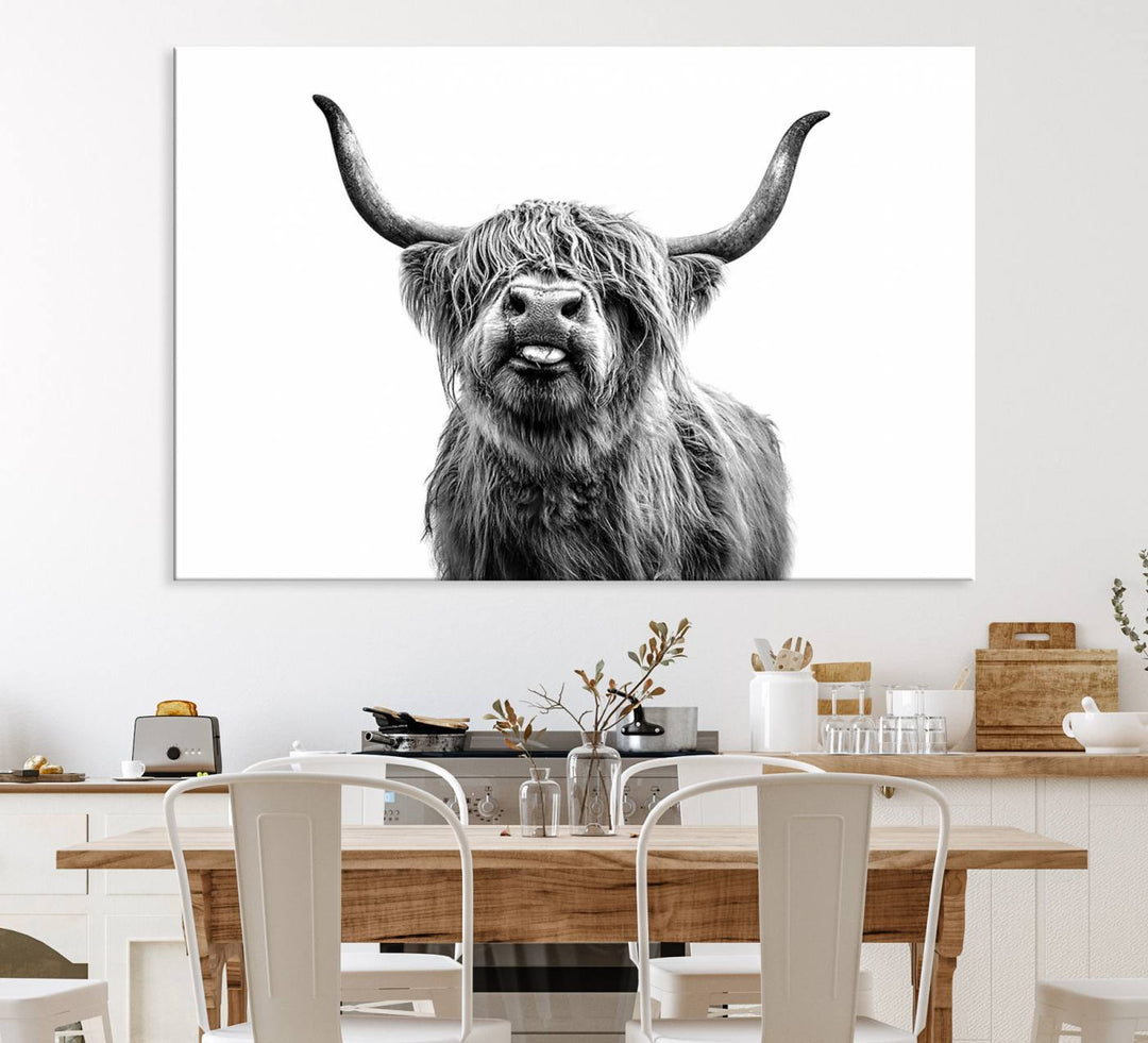 The Fanny Highland Cow art print decorates the modern kitchen, featured in black and white.