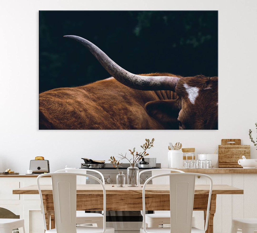 The kitchen dining area features a Texas Longhorn Bull wall art.