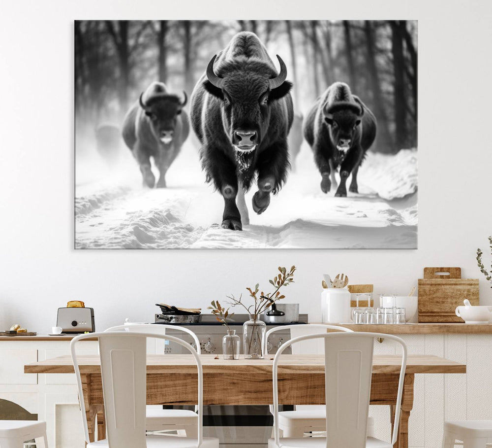 The Buffalo Wall Art Canvas Print of bison running through snow adorns the wall.