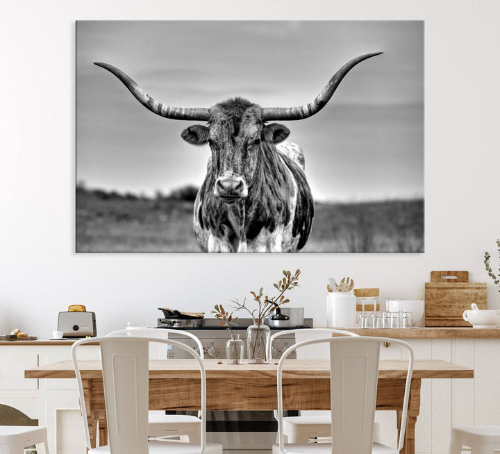 The Texas Longhorn Cow wall art, divided into three panels, is of gallery quality and displayed on a dark wall.