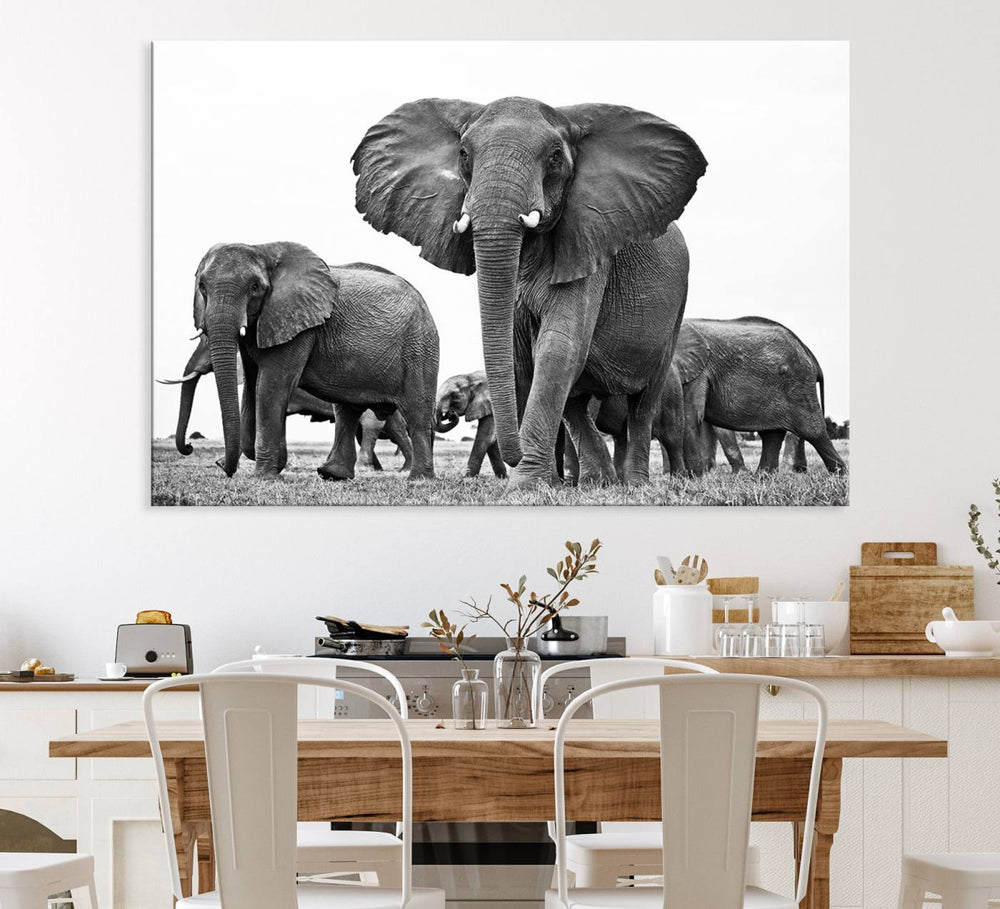 A modern dining area features a Black White Elephant Family Wall Art Canvas Print.