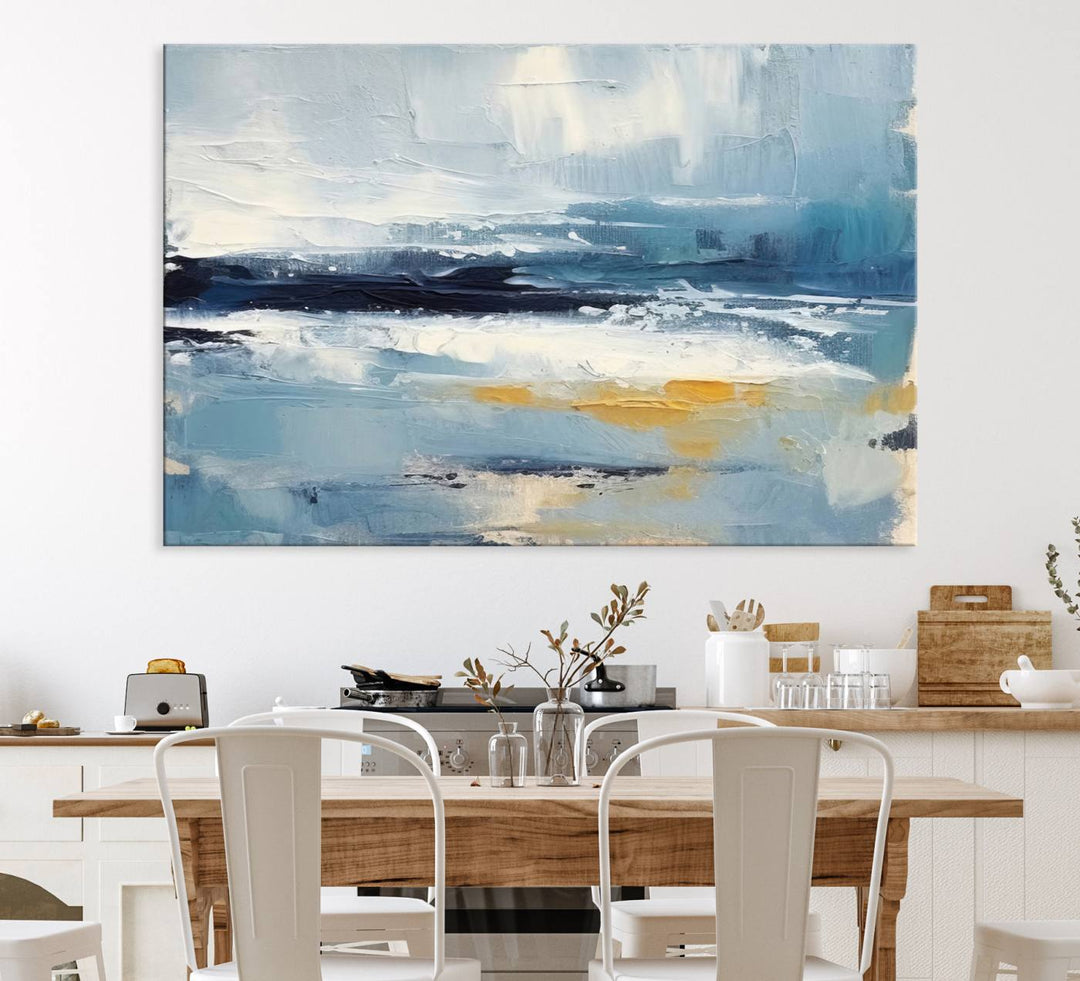 The Abstract Ocean Canvas Wall Art in coastal blue and gold enhances the modern kitchen.