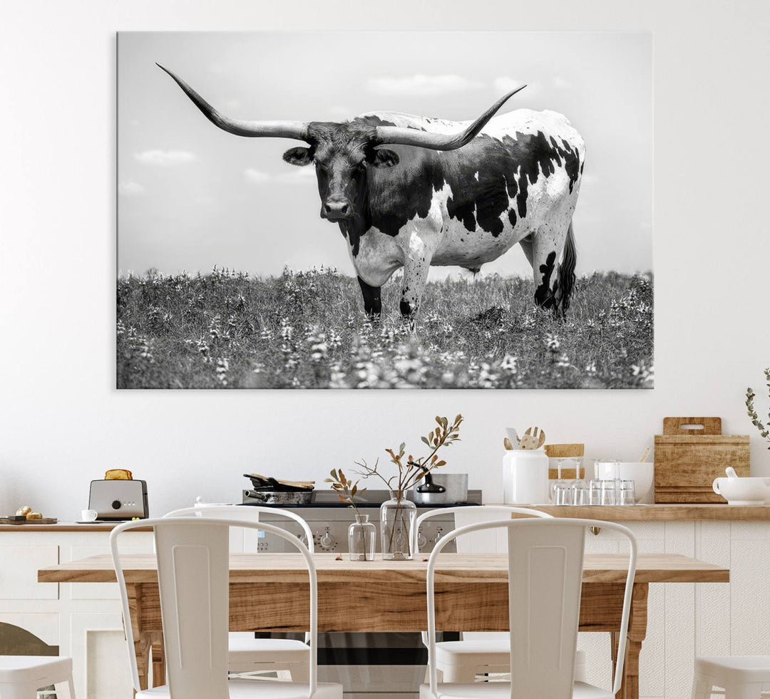 Texas Black White Highland Longhorn Cow Wall Art Canvas displayed on the wall.