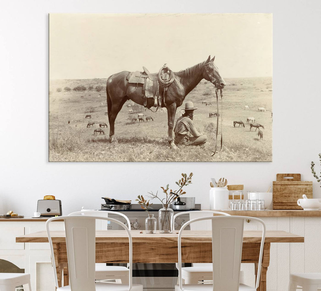 Cowboy Wall Art - Vintage Western Horse Canvas Print features a cowboy kneeling by his horse in a field.