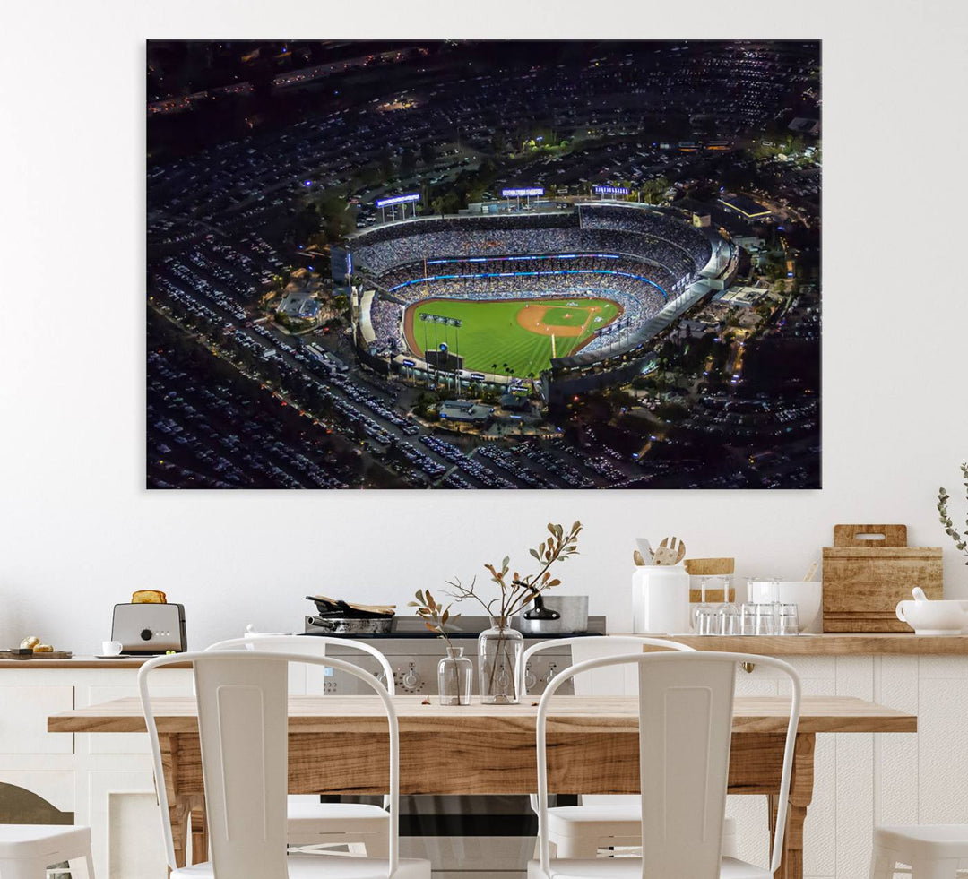 A large Los Angeles Dodgers print of Dodger Stadium at night is displayed near a window.