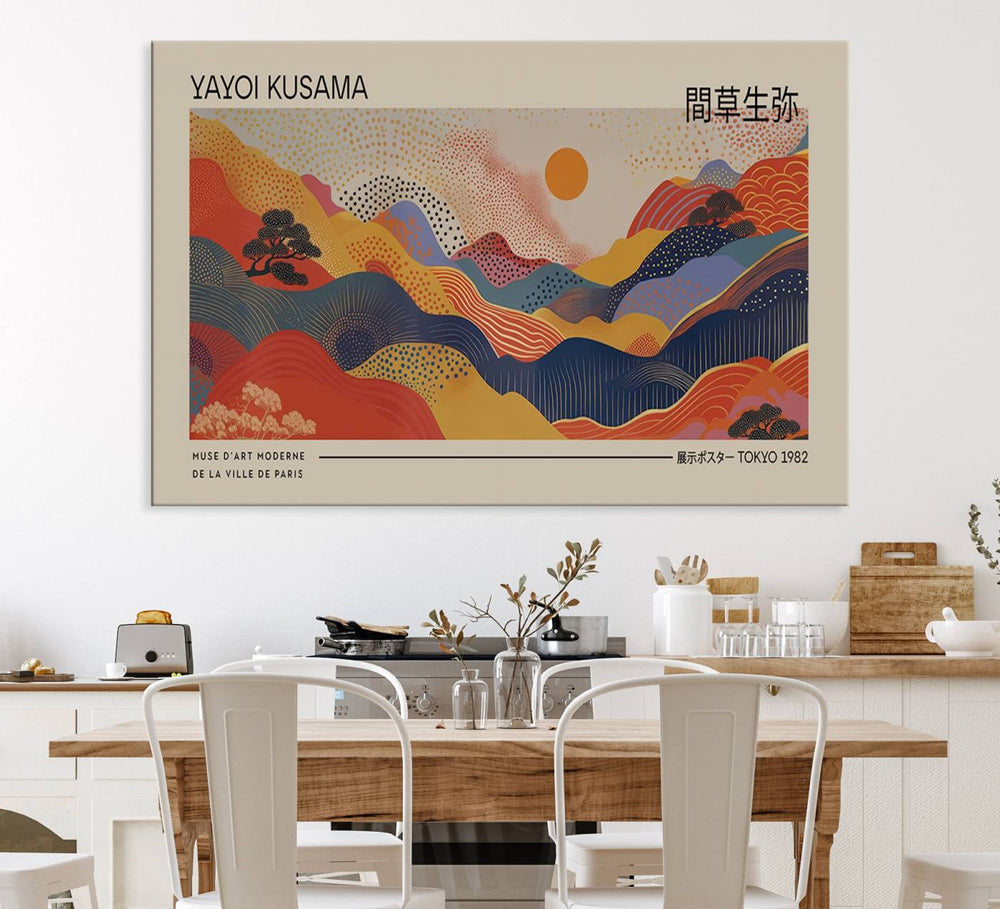 The Yayoi Kusama vibrant landscape canvas print featuring abstract mountains and a sun enhances the space with its modern aesthetic.