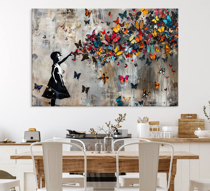 The Banksy Butterfly Girl 3-piece canvas art showcases a silhouette of a girl surrounded by colorful butterflies, perfect for modern living room decor.