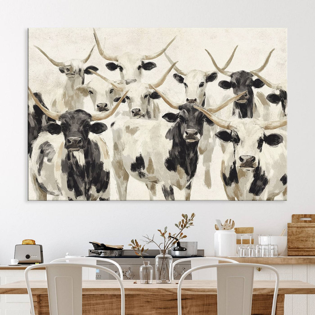 Canvas print titled Longhorn Texas Cow Drawing, depicting longhorn cattle with black and white markings, made in the USA, displayed on the wall.