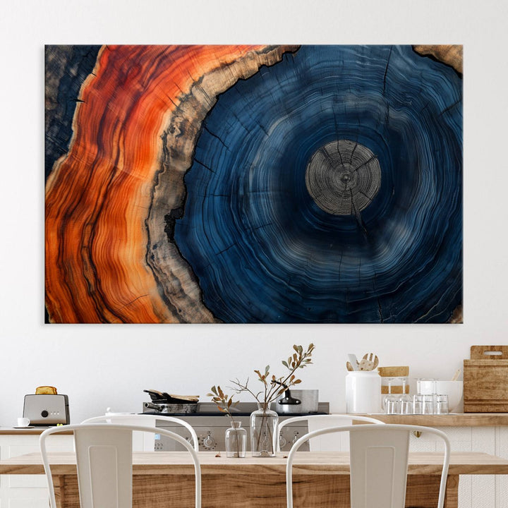 Abstract Tree Ring Wall Art Print on canvas featuring vibrant blue, orange, and brown rings with a natural rustic wood texture. Free shipping available!.