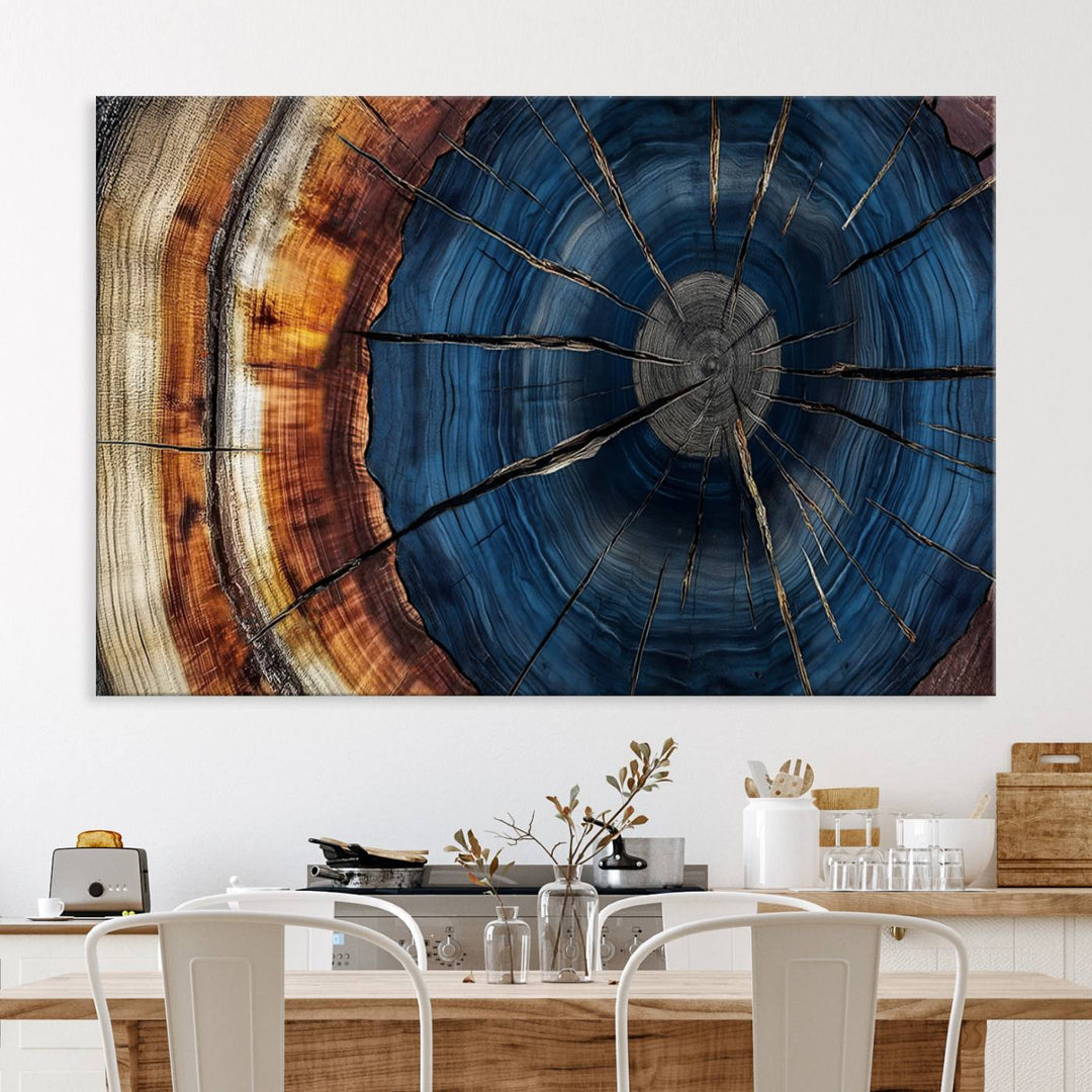 The Abstract Tree Rings Canvas Print features blue, brown, and orange rings that highlight wood grain and natures beauty.