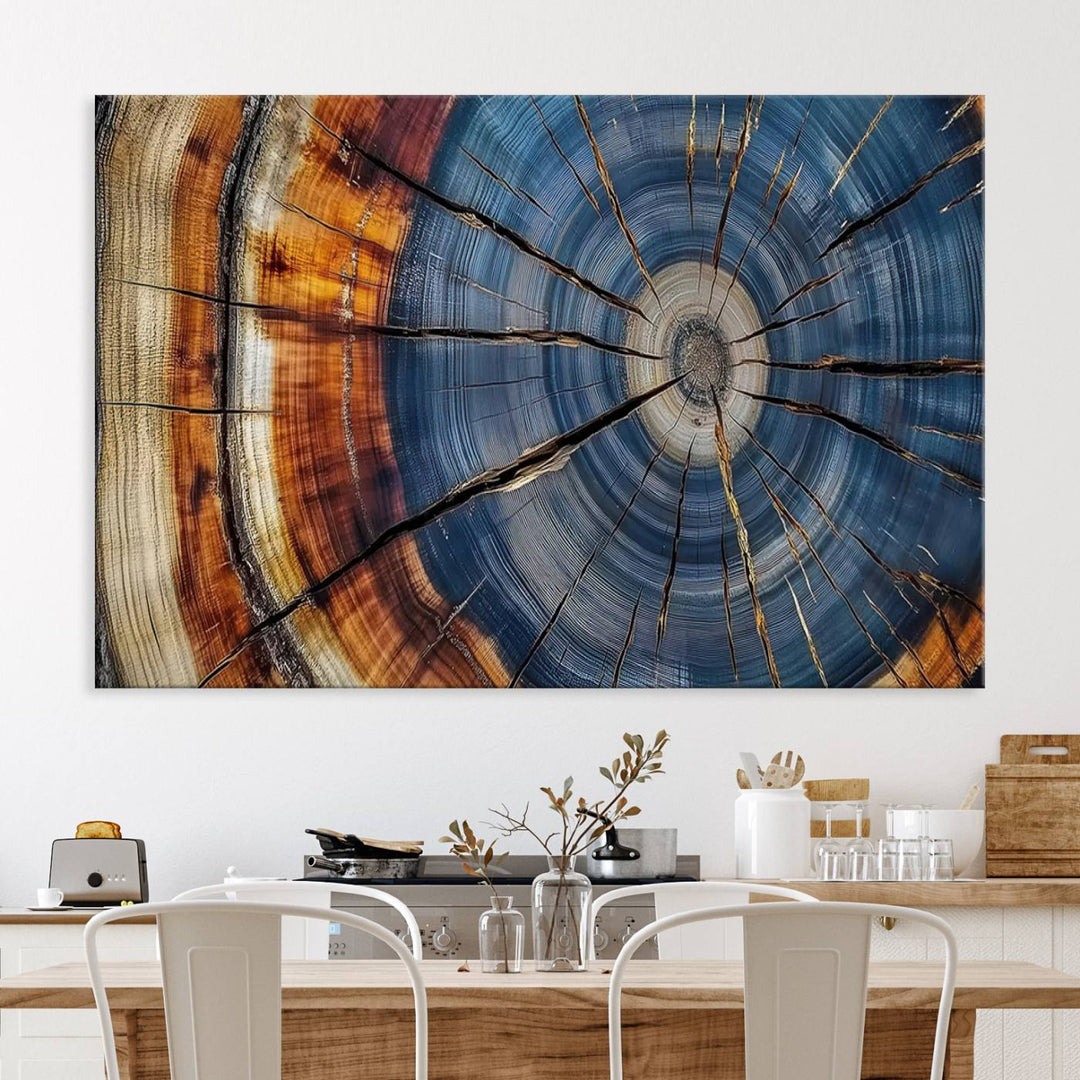 Close-up of blue, brown, and orange wood grain rings on the Abstract Tree Rings Canvas Wall Art Print.