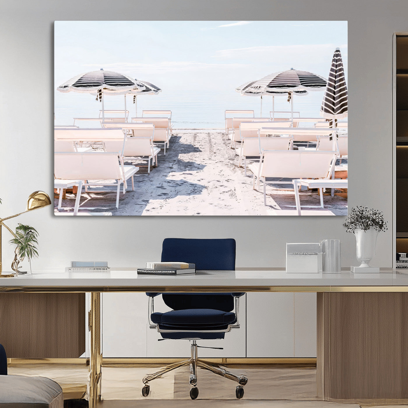 A serene minimalist beach scene featuring striped umbrellas, soft pastel sand, and an elegant lounge setup, creating a tranquil and stylish coastal retreat.