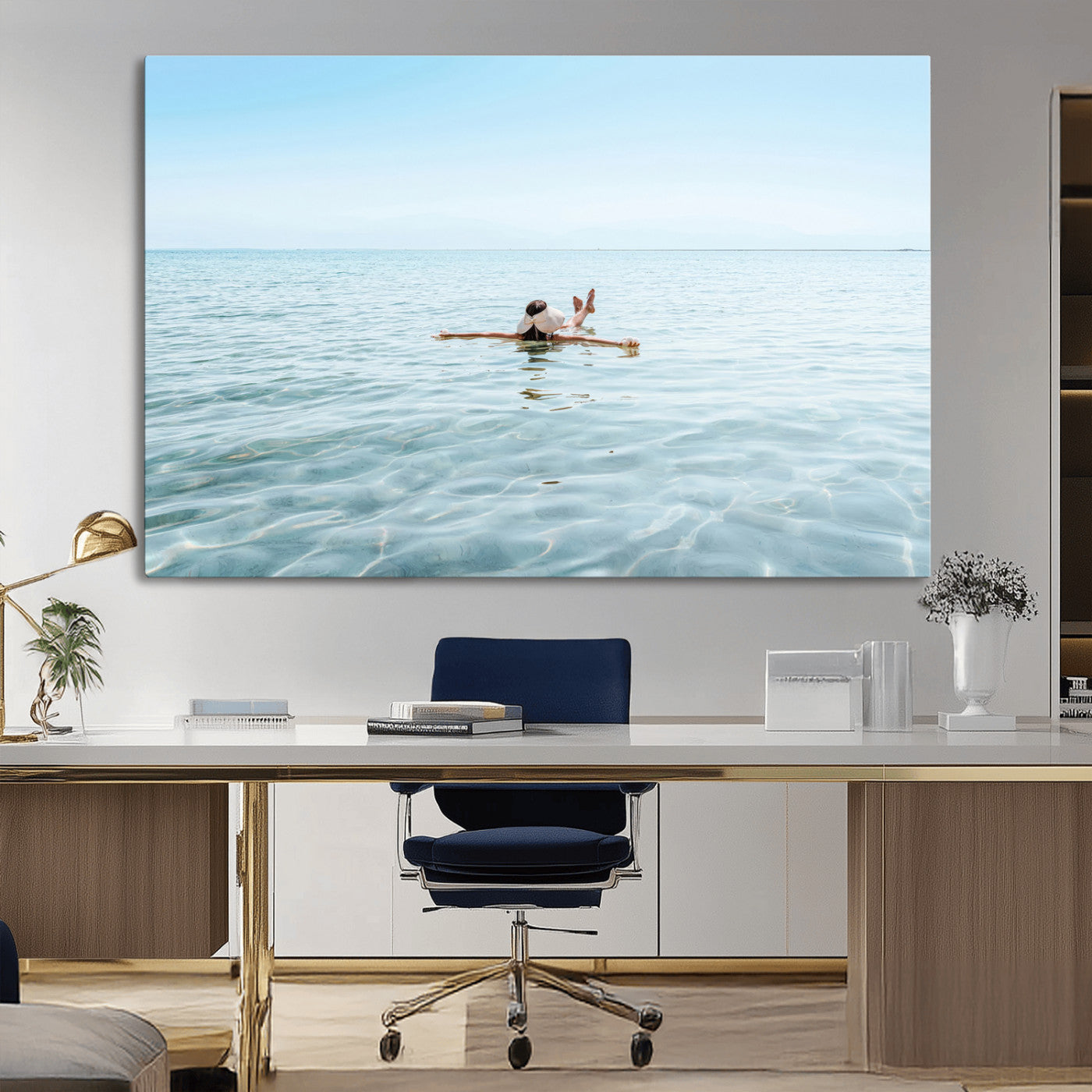 A peaceful minimalist scene of a person floating on crystal-clear water, surrounded by a vast open horizon, capturing relaxation and serenity in a tranquil aquatic setting.