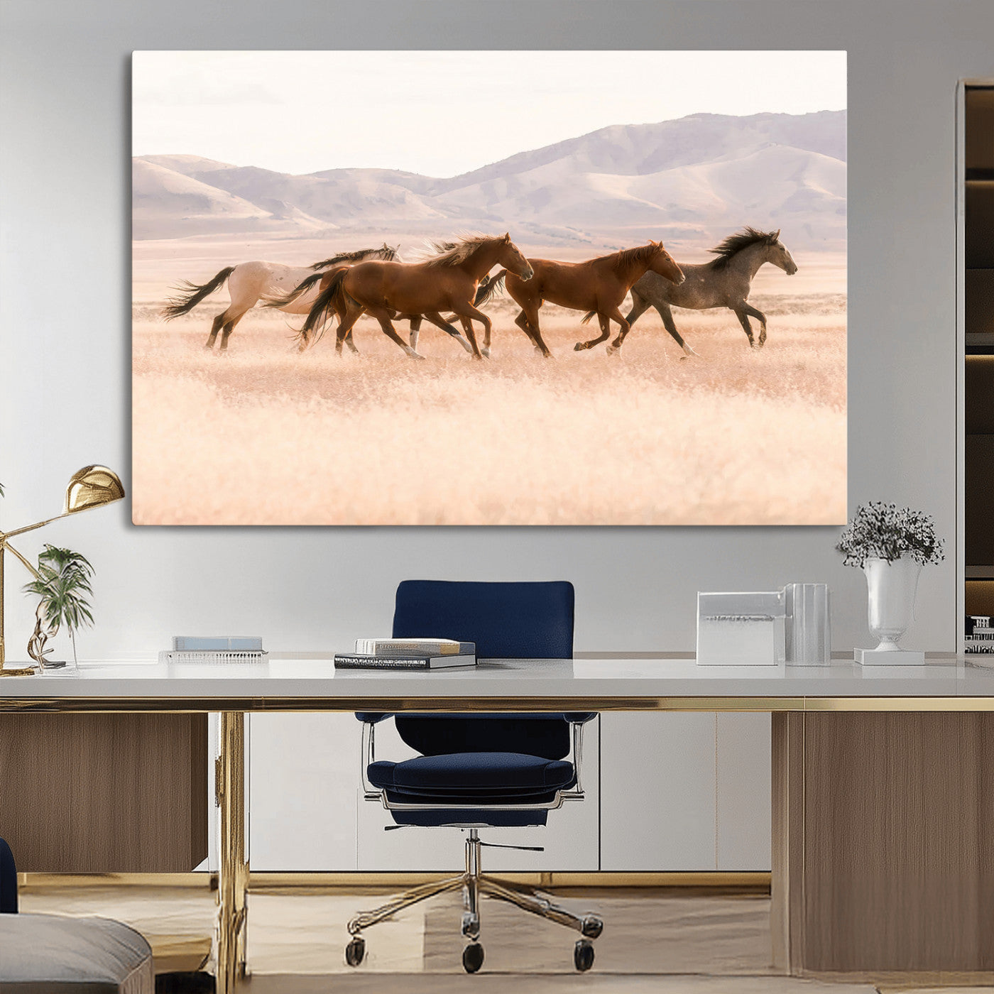 A herd of wild horses galloping through a sunlit desert plain with mountains in the background, perfect for rustic or western-themed wall decor.