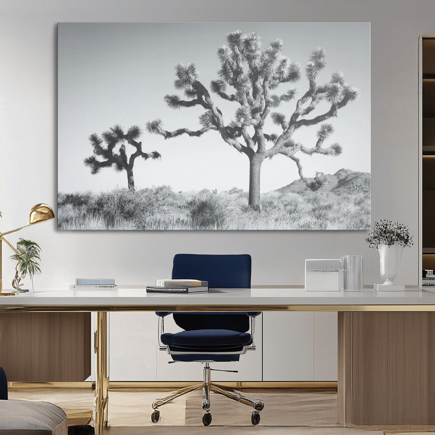 Two Joshua trees in a black and white desert landscape with distant hills, ideal for boho or rustic interior wall styling.