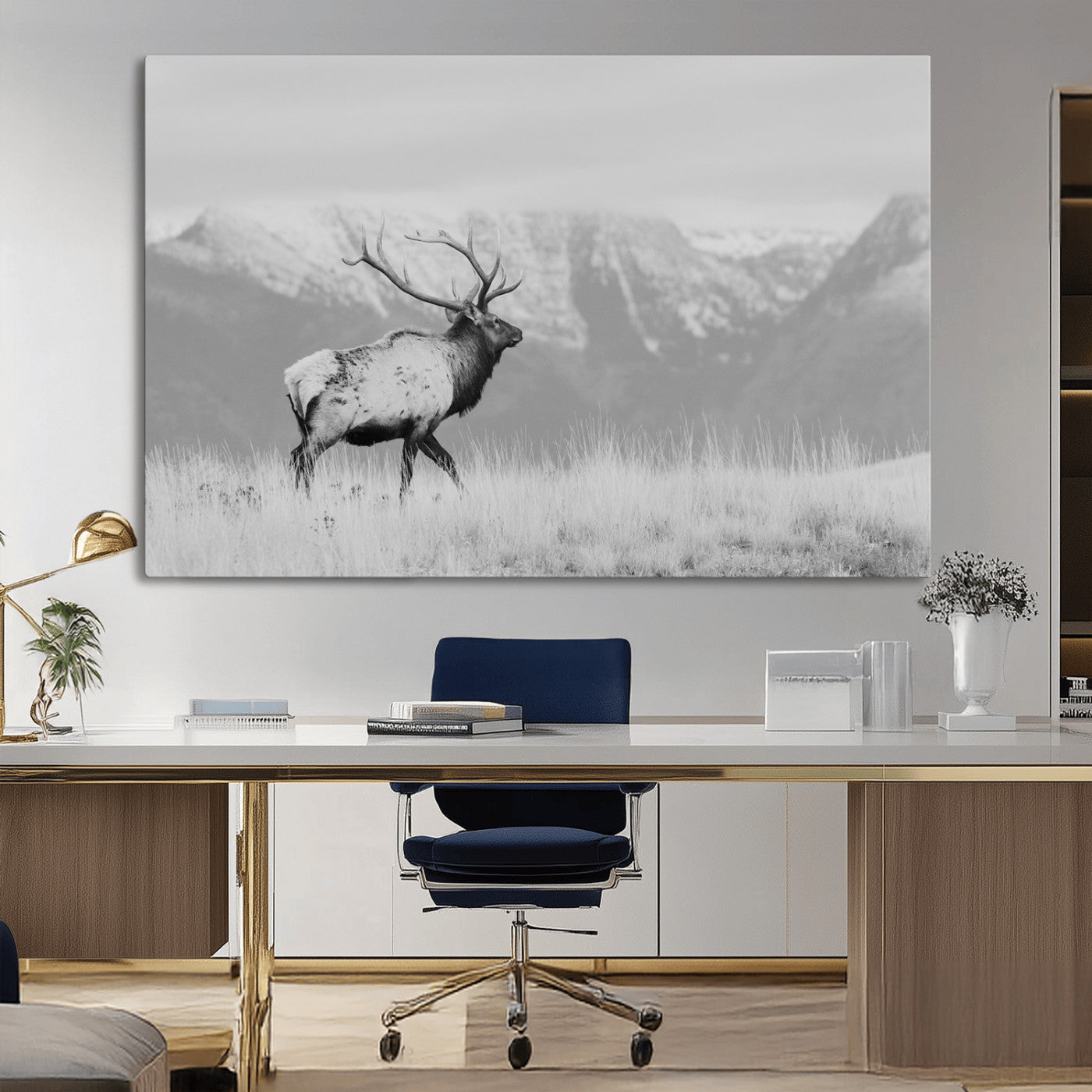 Black and white elk standing in front of snowy mountain range, perfect for rustic lodge or nature-inspired wall decor.