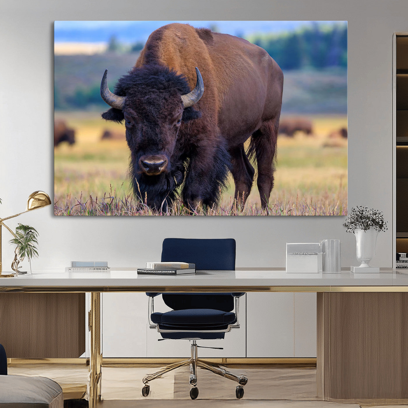 Close-up of a strong American bison standing in a grassy prairie with a blurred herd in background, perfect for rustic lodge decor.