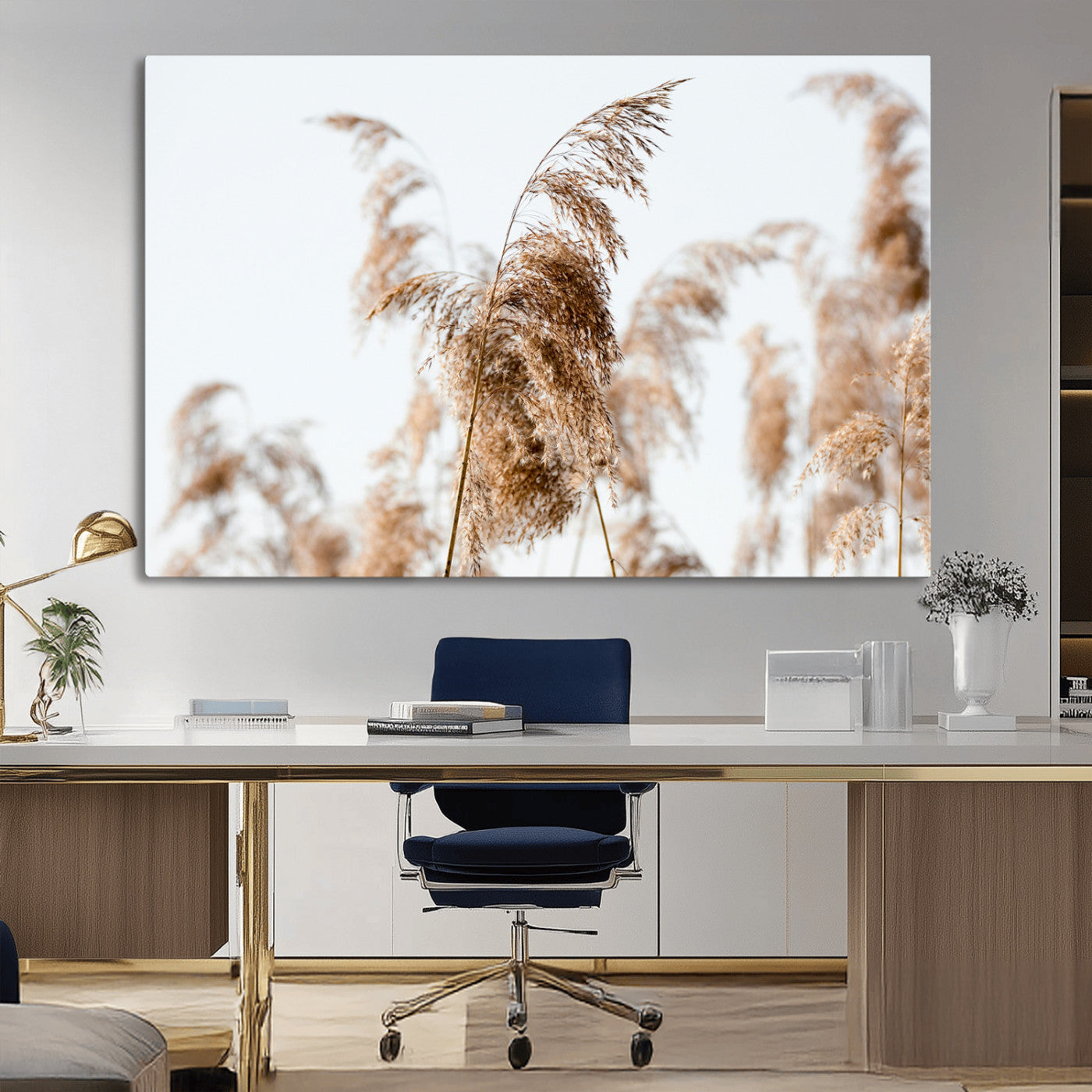 Close-up of pampas grass swaying in the wind against a soft white sky, creating a neutral and minimalist botanical aesthetic.