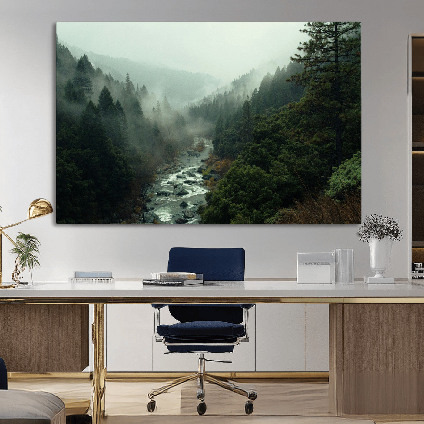 Misty forest with a winding river flowing through lush green mountains, creating a tranquil and moody wilderness landscape.