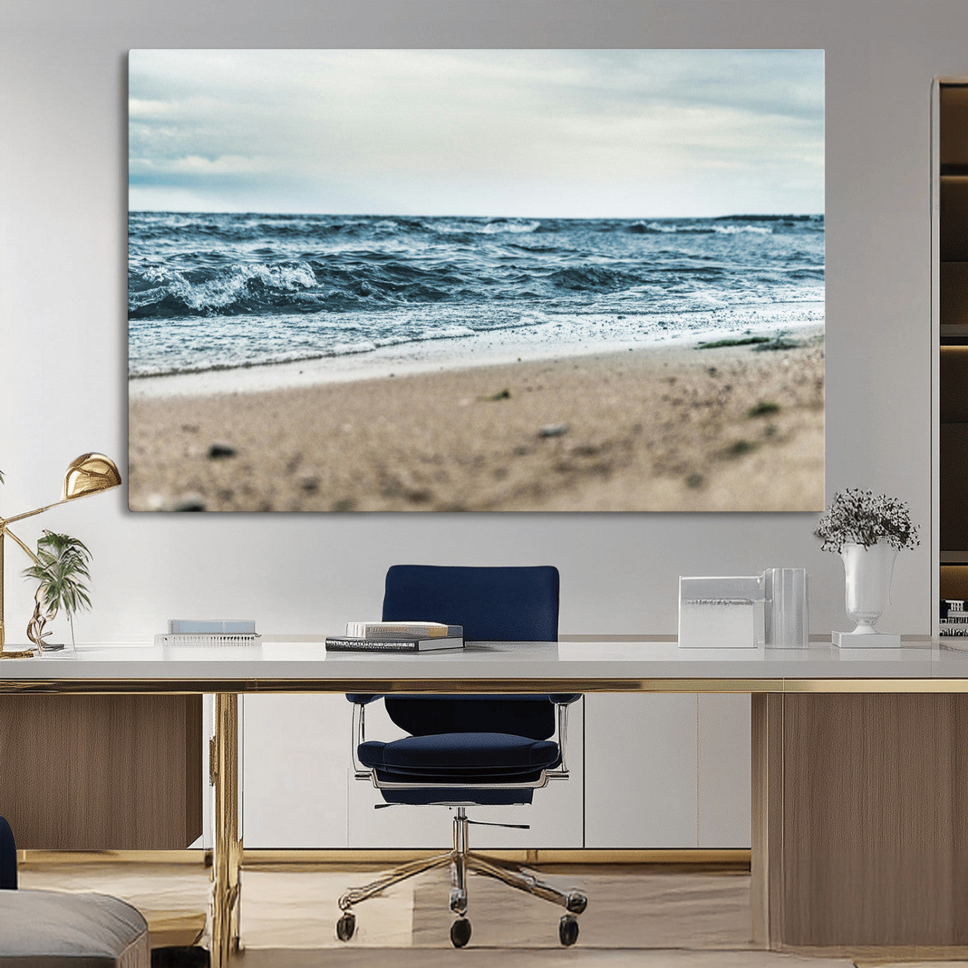 A moody ocean scene with gentle waves washing onto a sandy beach under a cloudy sky, creating a peaceful and coastal atmosphere.