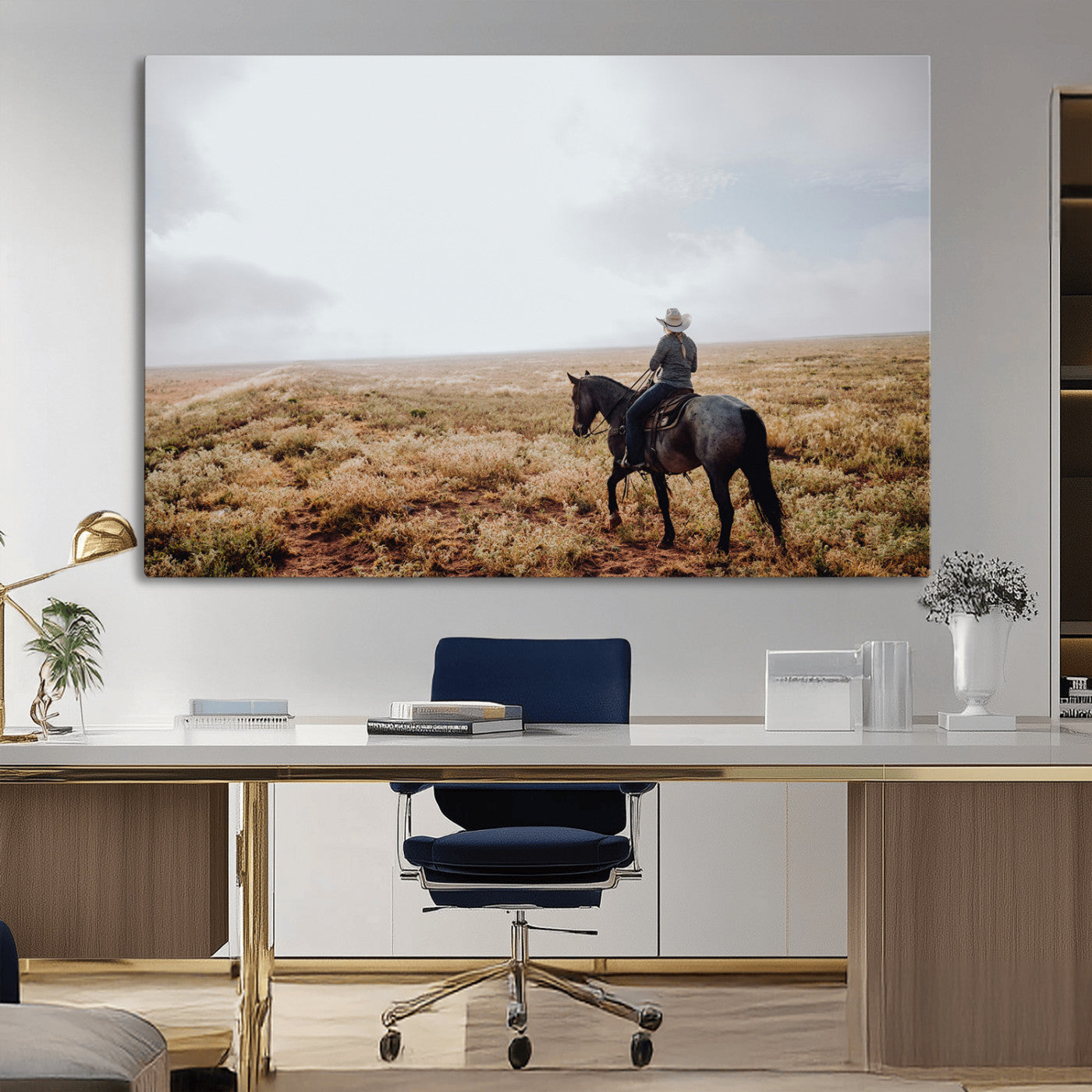 A lone cowboy riding horseback across an open prairie under a vast sky, capturing the rugged and timeless spirit of the Western frontier.