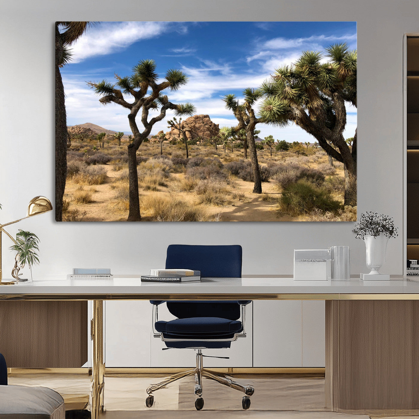 Scenic Joshua Tree landscape with rugged desert terrain, golden dry grass, and a deep blue sky, creating a warm, rustic Southwestern aesthetic.