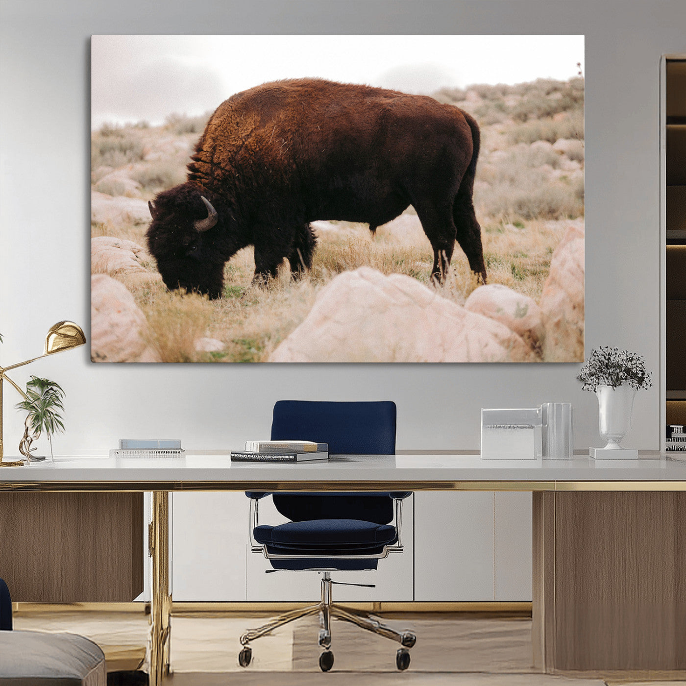 A solitary bison grazing in a rugged prairie with earthy tones and scattered rocks, capturing the essence of the American West for rustic decor.
