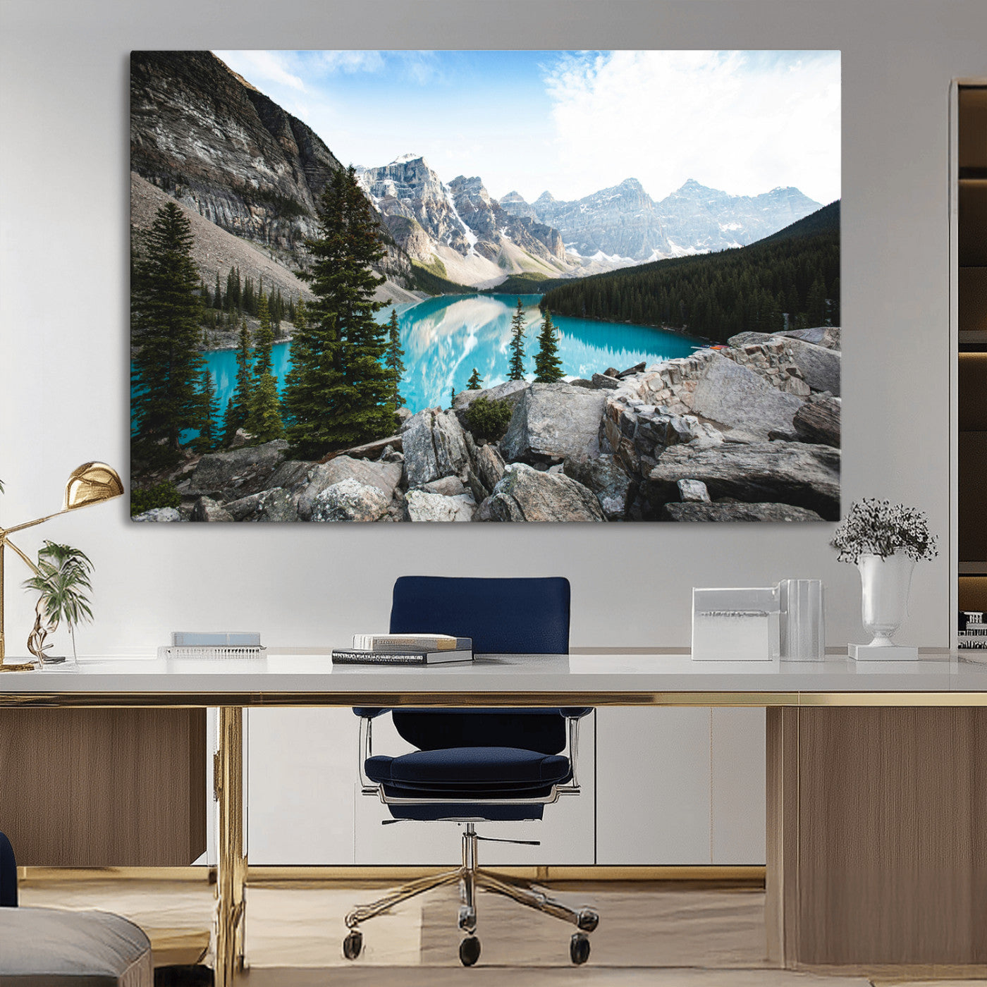 Stunning view of Moraine Lake with turquoise waters reflecting snow-capped mountains and evergreen trees, creating a peaceful alpine decor.