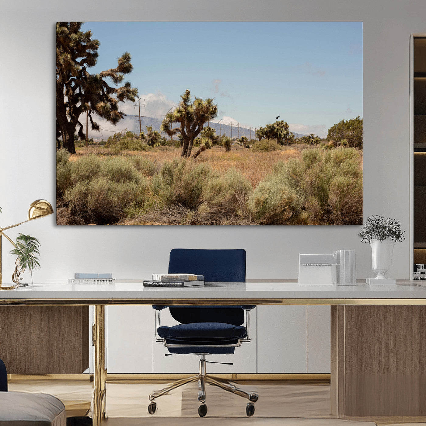 Scenic desert landscape with Joshua trees, dry grass, and distant mountains under a clear blue sky, perfect for southwestern and rustic decor.