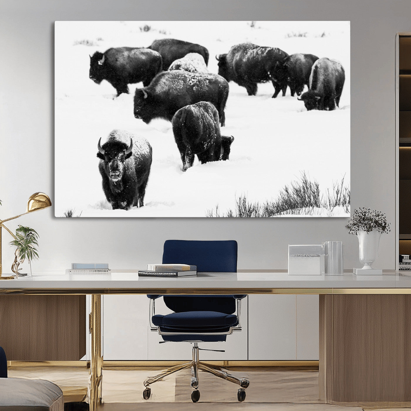 Black and white photograph of a bison herd in a snowy landscape, with snow-covered fur and a rugged wilderness setting, perfect for rustic lodge decor.