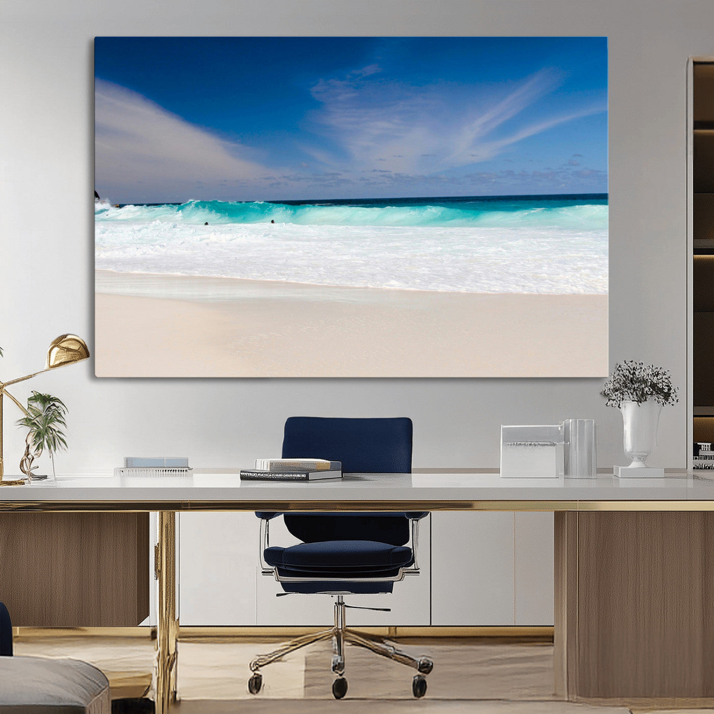 Turquoise waves crash onto a pristine white sand beach under a vivid blue sky with wispy clouds, creating a peaceful and refreshing coastal scene.
