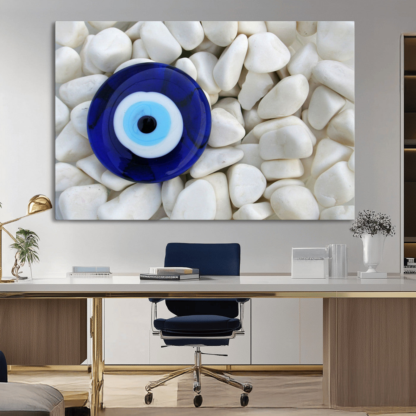 A close-up of a blue evil eye charm placed on white pebbles, symbolizing protection and good luck.