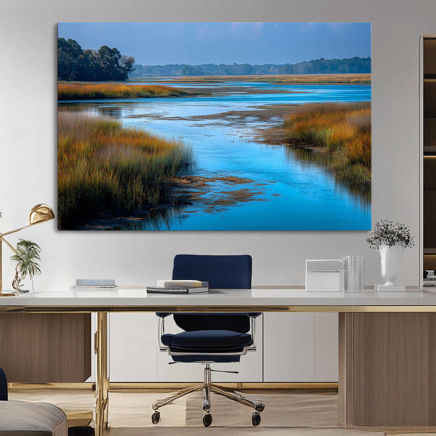 A peaceful marshland scene with calm blue water reflecting the surrounding grasses and trees, capturing the beauty of nature in a serene landscape.