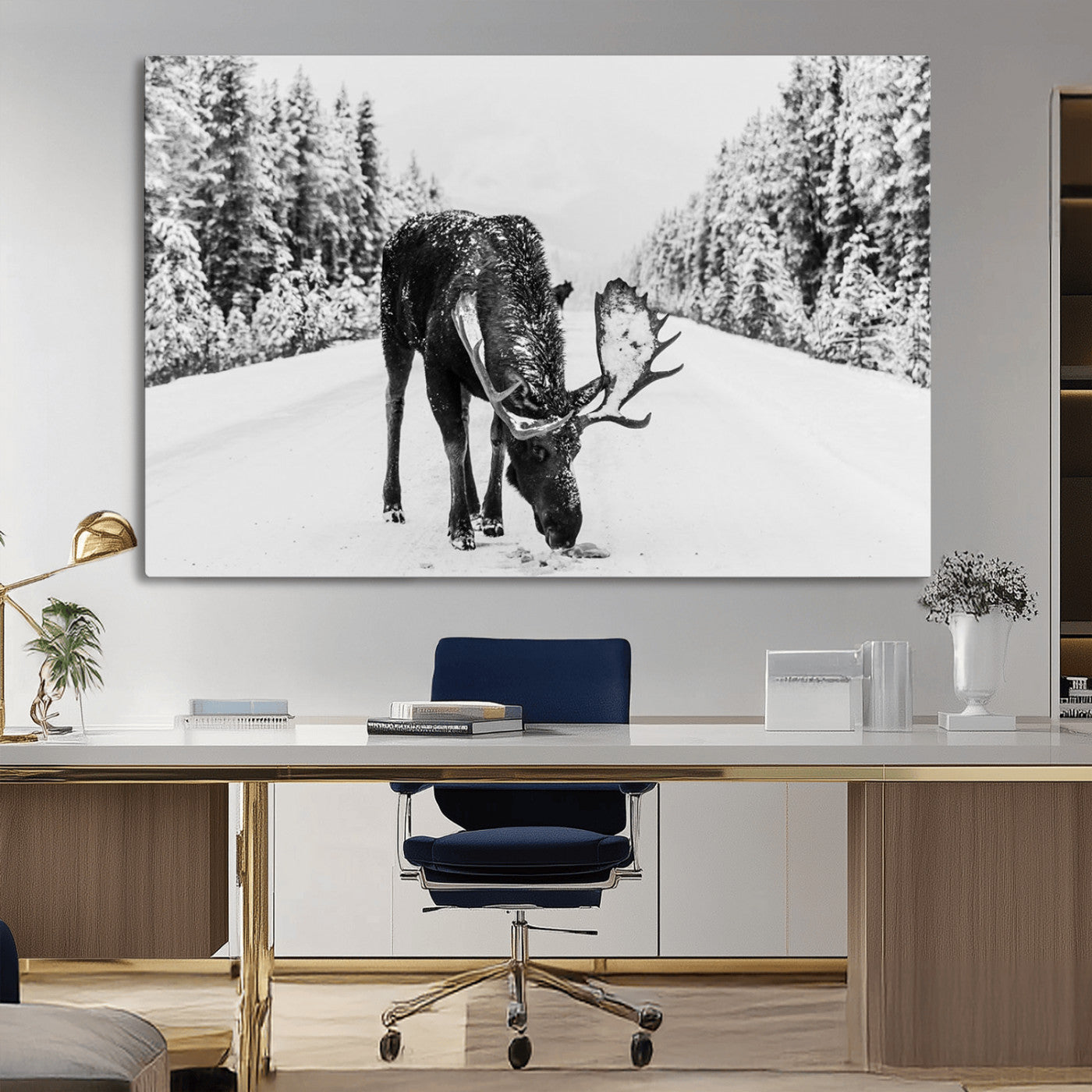 A majestic moose grazing in the snow-covered wilderness, surrounded by snow-covered trees, creating a peaceful winter scene.