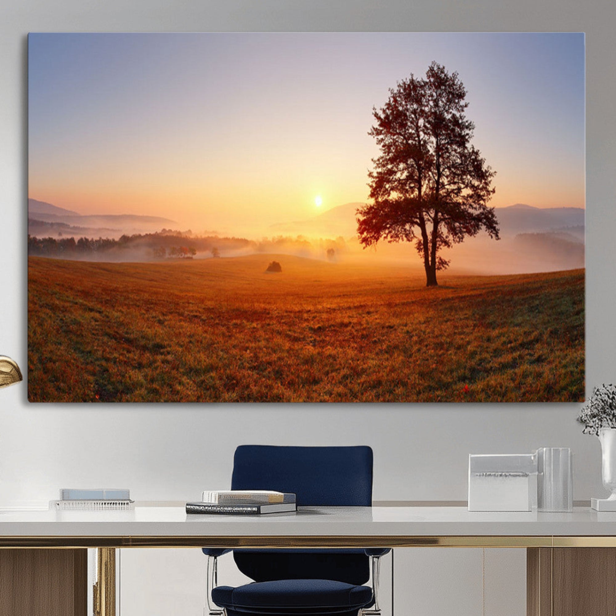 A tranquil landscape at sunrise with a mist-covered field and a lone tree, creating a peaceful and natural atmosphere.