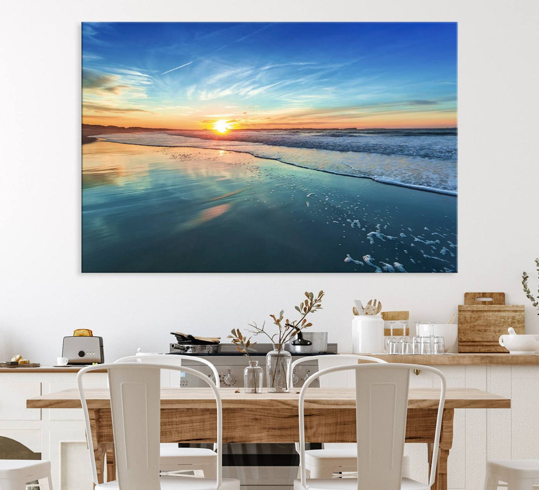 The Blue Sky and Beach Wall Art Canvas Print features a vibrant orange sky reflecting on wet sand.