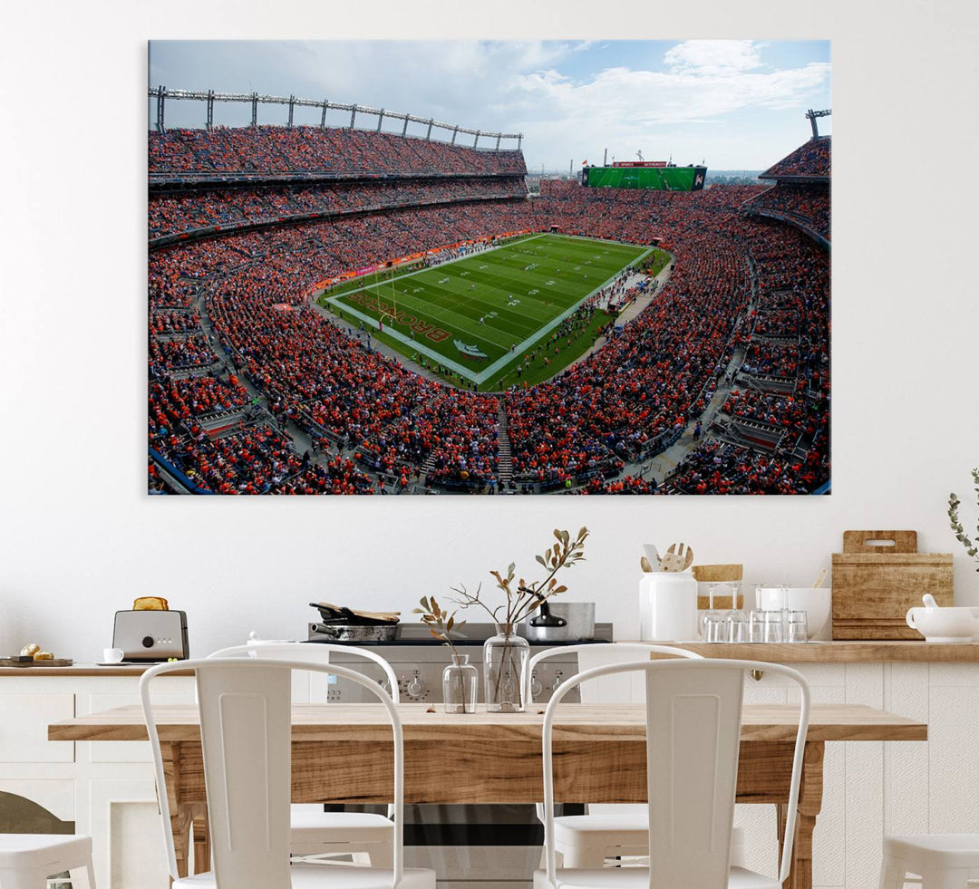 The Denver Broncos Football Print features a vibrant, fan-filled orange stadium overlooking the football field.