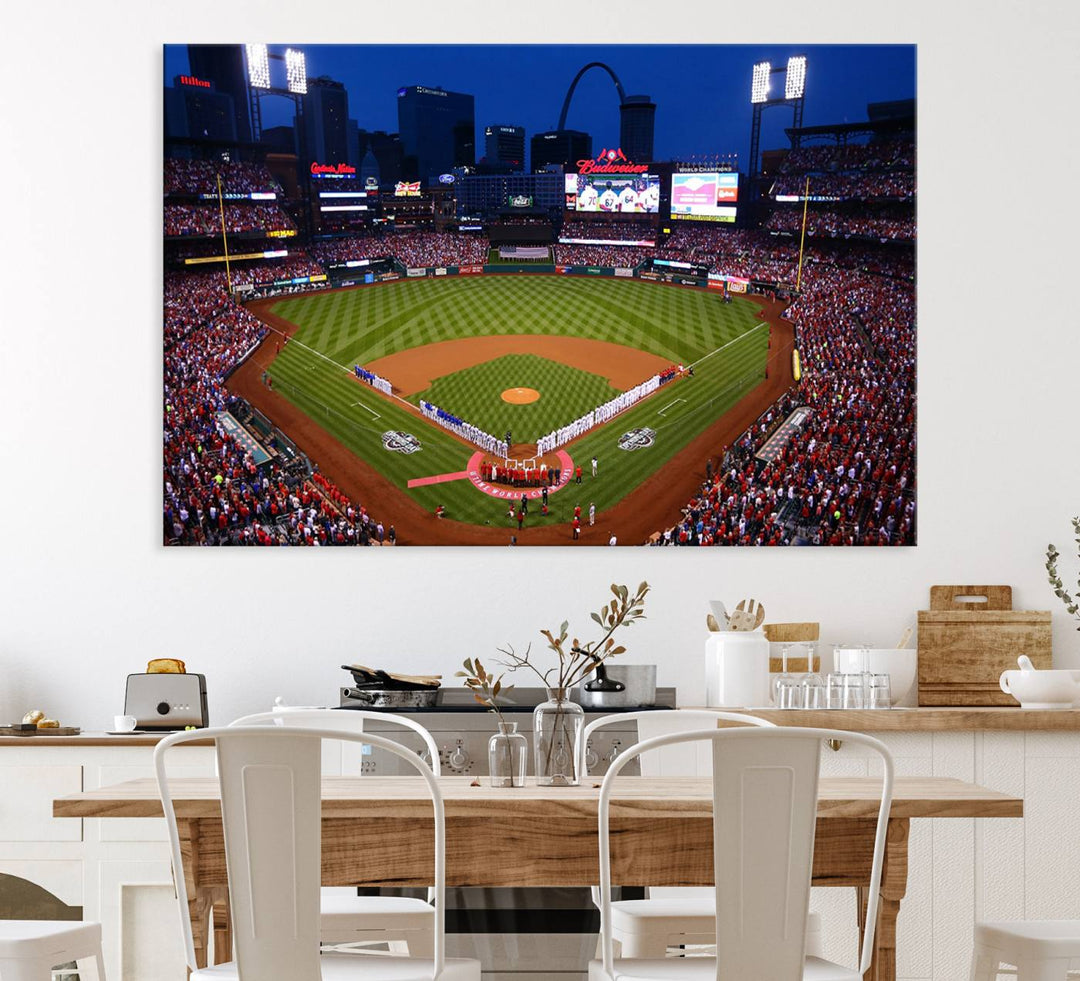 A Cardinals wall art canvas print depicts Busch Stadium with players lined up on the field and a full audience under the lights, capturing the vibrant atmosphere.