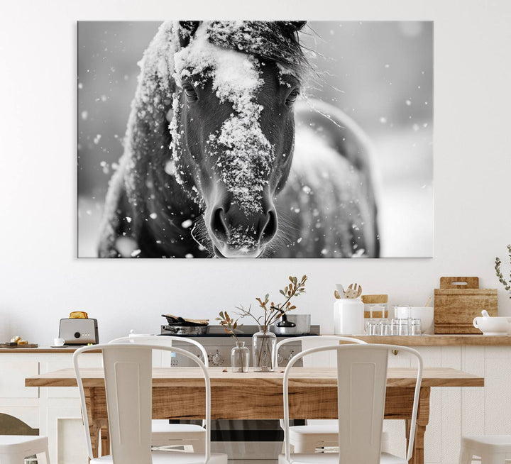 The Black and White Horse Winter Wall Art features a majestic horse with snow-covered hair set against a serene winter backdrop.