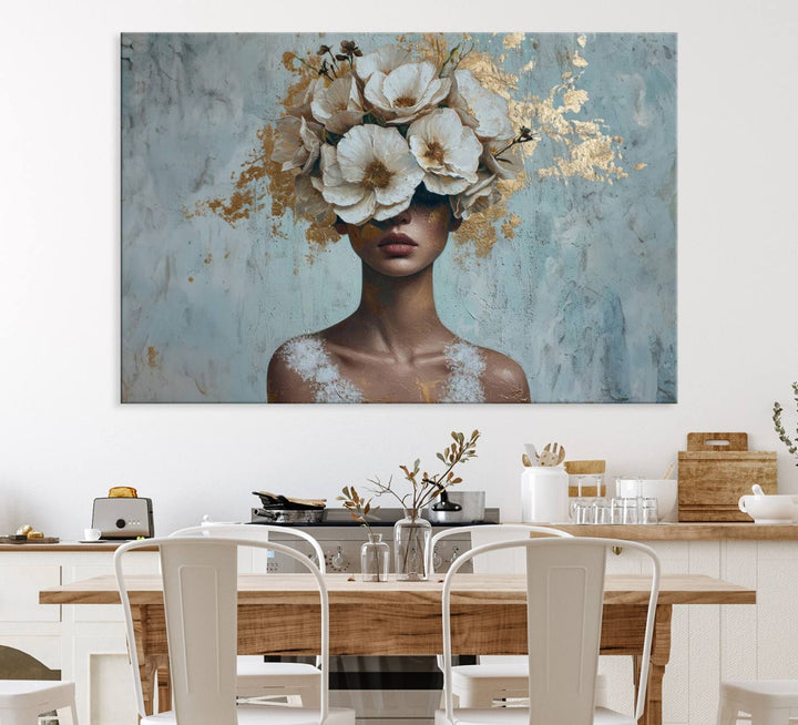 Golden Petal Wall Art: A womans face adorned with a gold floral design on a teal background, presented in a 3-panel modern glam canvas.