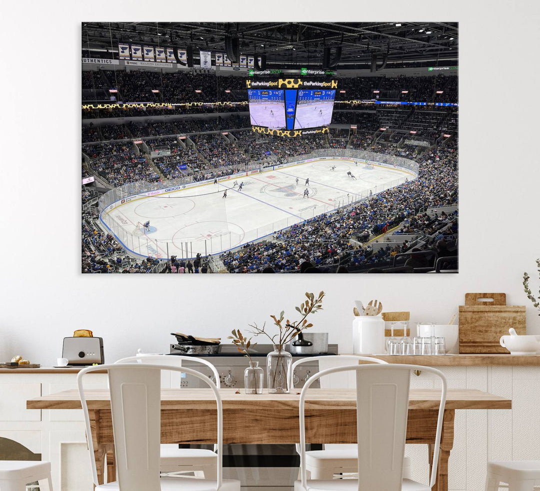 A large Enterprise Center canvas of a crowded hockey arena hangs prominently.