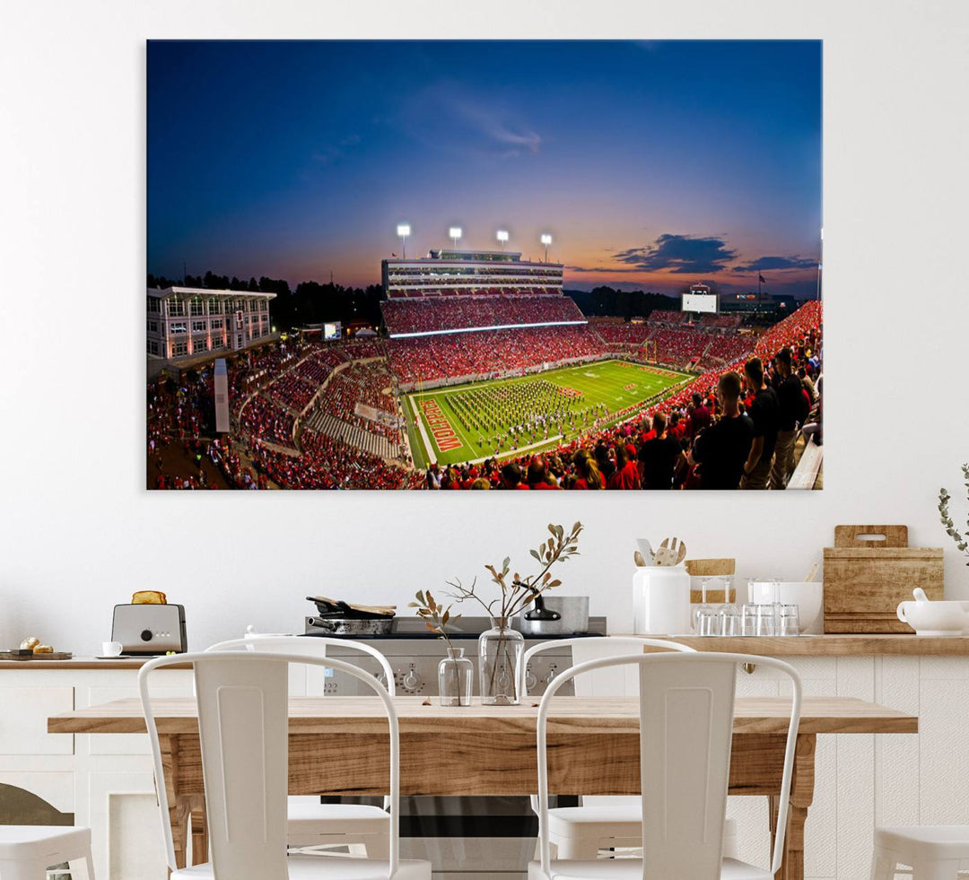 A vibrant and dynamic painting captures the essence of an electrifying night game at Carter-Finley Stadium, highlighting the illuminated atmosphere as the NC State Wolfpack competes under bright stadium lights.